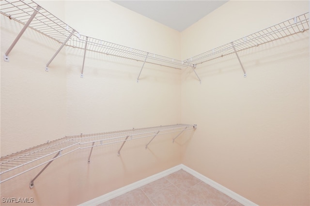 walk in closet featuring tile patterned floors