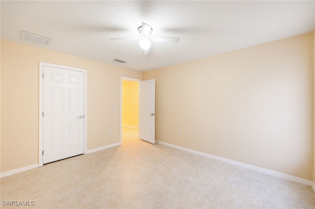 spare room featuring ceiling fan