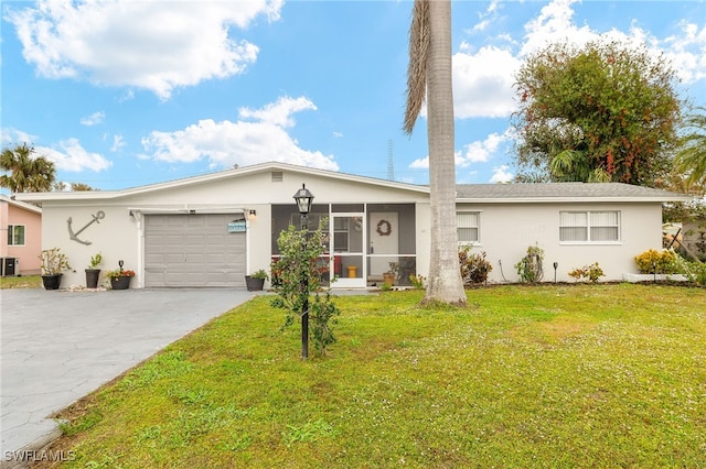 ranch-style home with a garage, a front lawn, a sunroom, and central AC unit