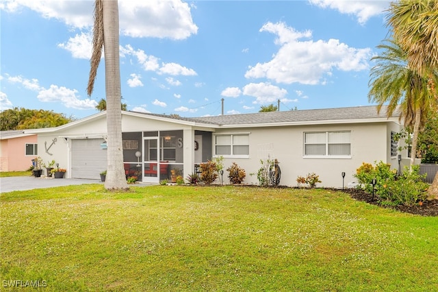 single story home featuring a front yard, a garage, and a sunroom