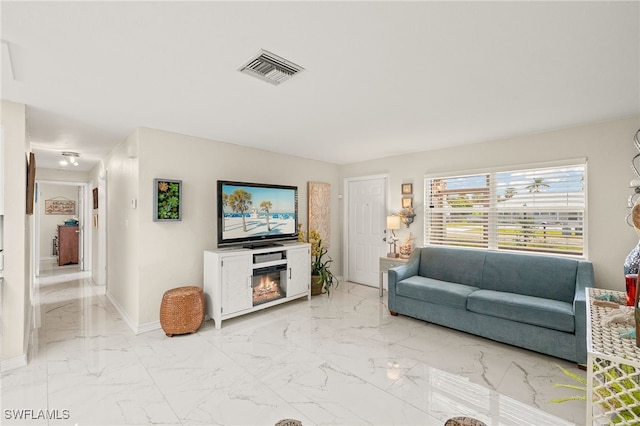 living room featuring a fireplace