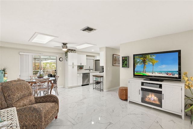 living room featuring ceiling fan