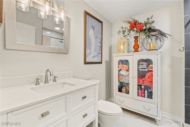 bathroom with toilet, a shower with shower curtain, and vanity