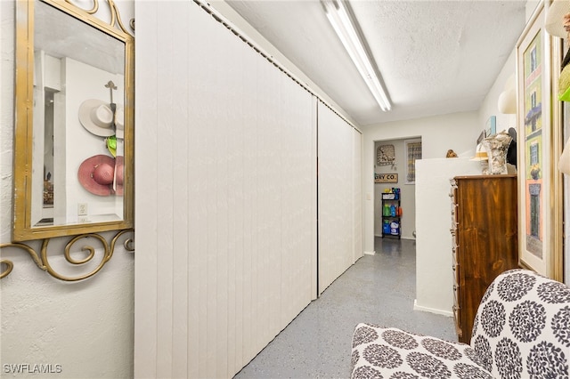 corridor with a textured ceiling