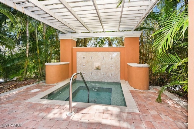 view of swimming pool with an in ground hot tub and a pergola