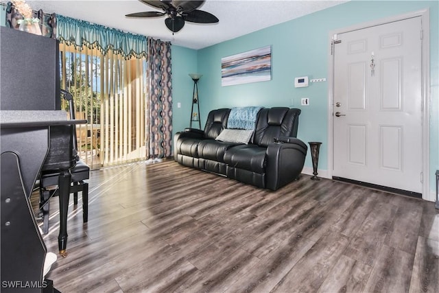 living room with hardwood / wood-style flooring and ceiling fan