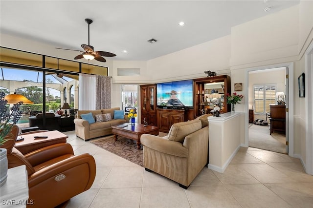 tiled living room featuring ceiling fan