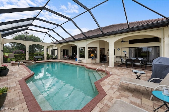 view of pool featuring ceiling fan, a grill, glass enclosure, and a patio