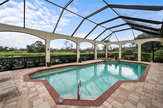 view of swimming pool featuring an in ground hot tub, a lanai, and a patio