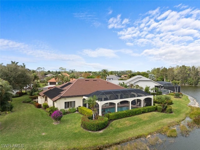20273 Leopard Ln, Estero, FL 33928 - rear view of property featuring a yard, a tiled roof, a water view, an outdoor pool, and glass enclosure