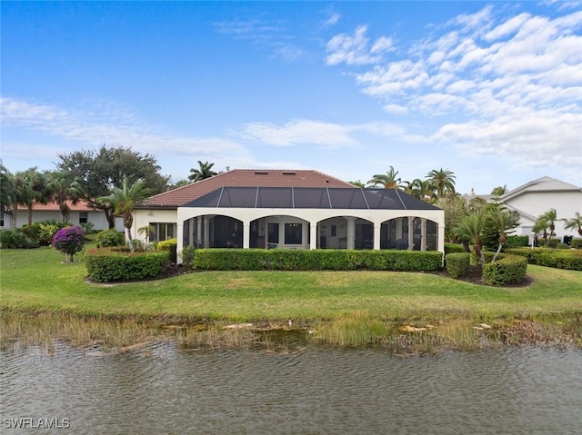 20273 Leopard Ln, Estero, FL 33928 - rear view of property featuring a water view, a lawn, and a lanai