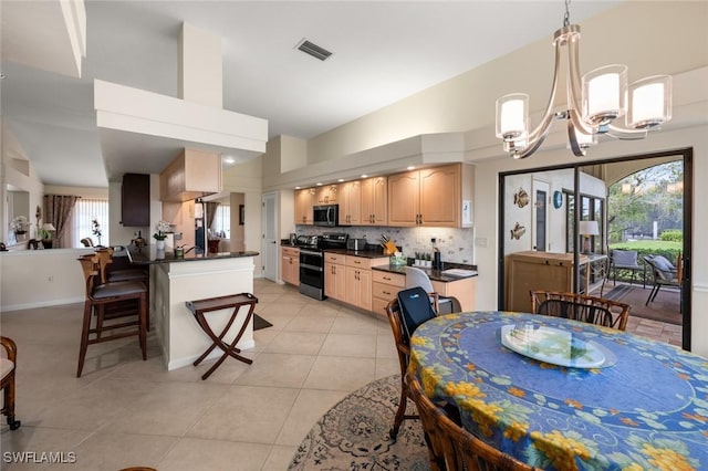 20273 Leopard Ln, Estero, FL 33928 - dining area with a chandelier, light tile patterned floors, and a towering ceiling