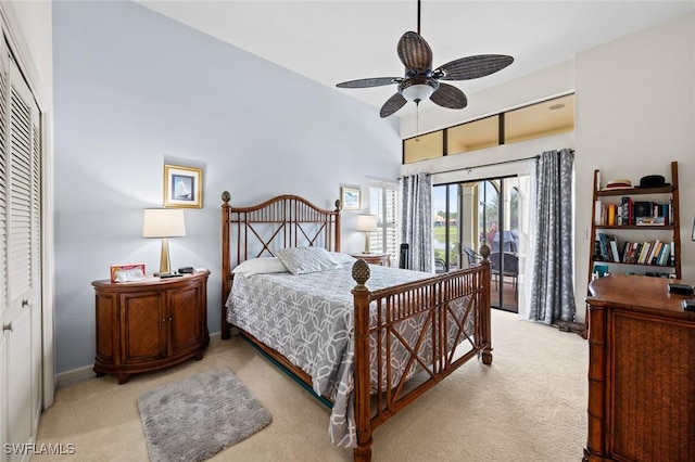 carpeted bedroom with a closet and ceiling fan