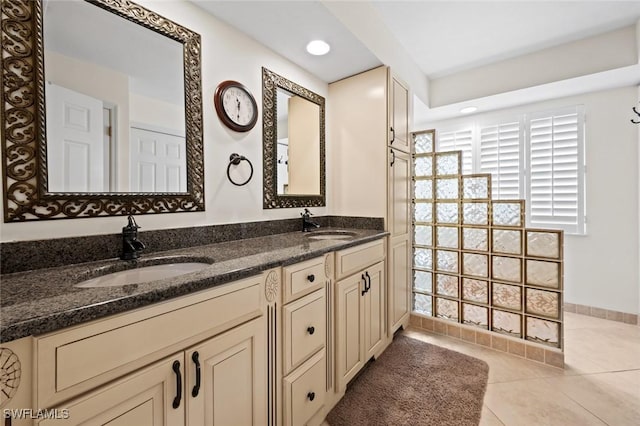 20273 Leopard Ln, Estero, FL 33928 - bathroom featuring double vanity, tile patterned floors, and recessed lighting