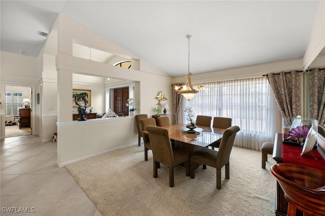 dining area featuring light tile patterned floors and lofted ceiling