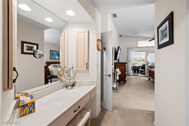 bathroom featuring ceiling fan and vanity