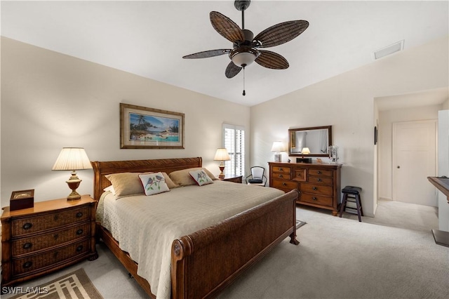 bedroom with ceiling fan, light colored carpet, and lofted ceiling