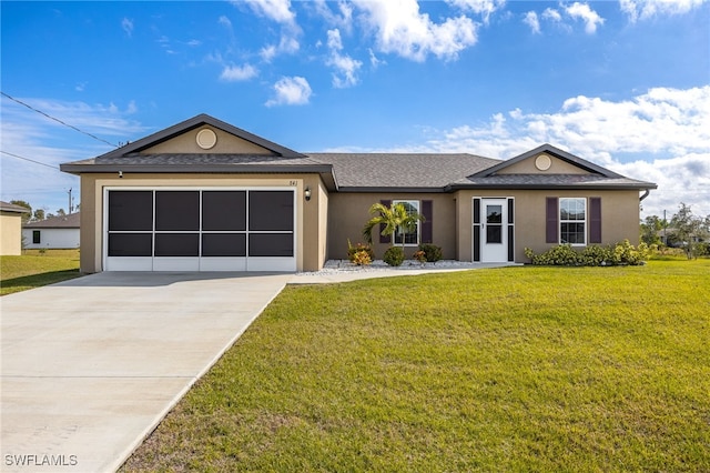 ranch-style house featuring a garage and a front lawn