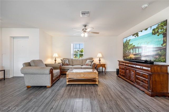 living room featuring ceiling fan and hardwood / wood-style flooring