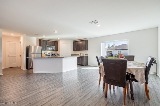 dining room featuring light hardwood / wood-style floors