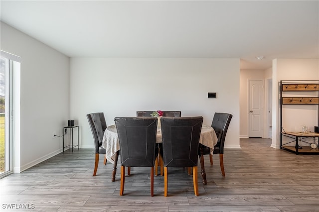 dining area with hardwood / wood-style floors