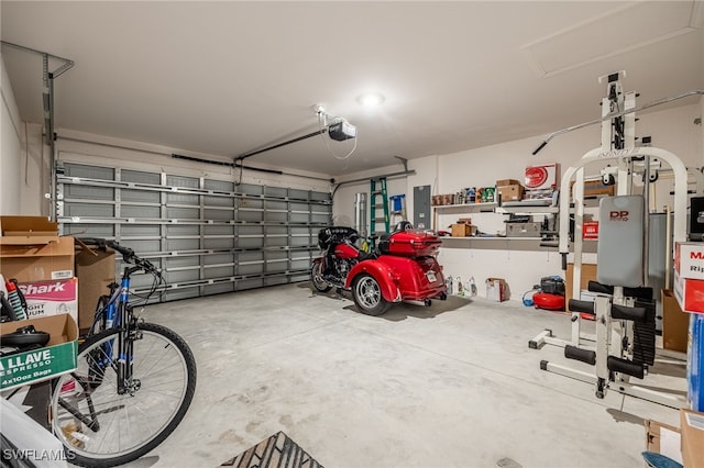 garage featuring electric panel and a garage door opener