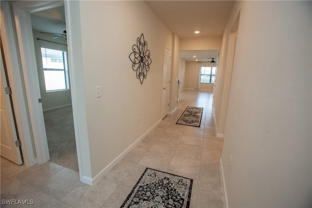 hallway with light tile patterned floors