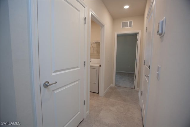 corridor featuring washer / clothes dryer