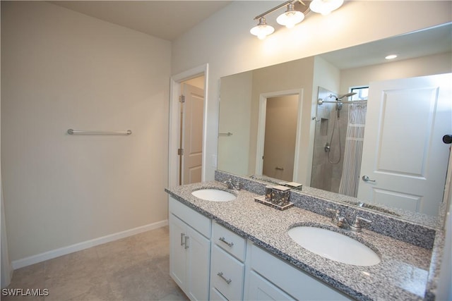 bathroom featuring a shower with shower curtain, vanity, and tile patterned floors