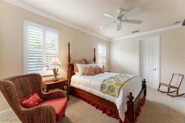 carpeted bedroom featuring ceiling fan and crown molding