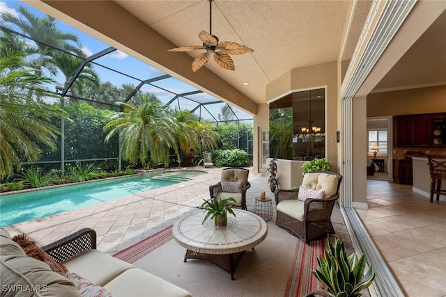 view of patio / terrace with glass enclosure, ceiling fan, and an outdoor hangout area