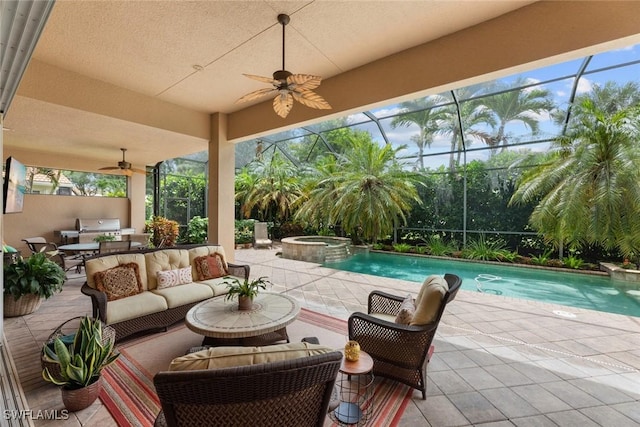 view of swimming pool with an in ground hot tub, a lanai, outdoor lounge area, and a patio area