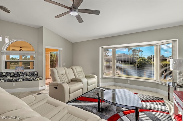 living room with ceiling fan and vaulted ceiling