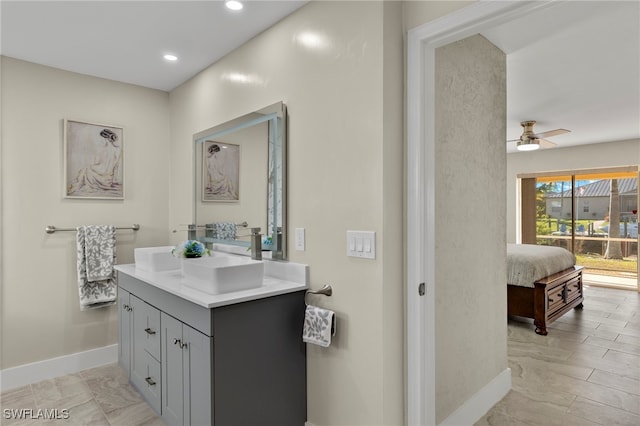 bathroom with ceiling fan and vanity