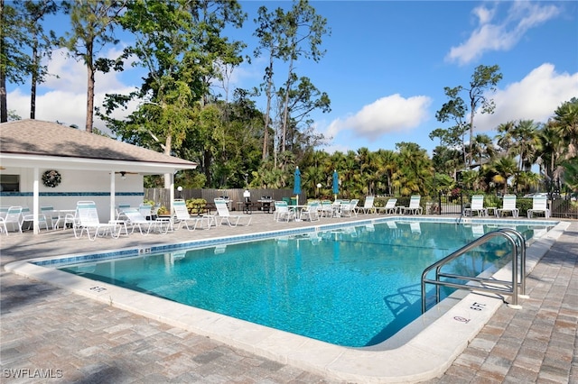 view of swimming pool with a patio