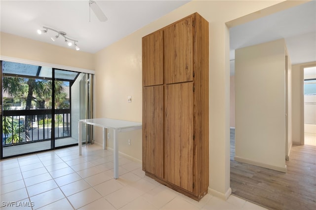 kitchen featuring ceiling fan and light tile patterned flooring