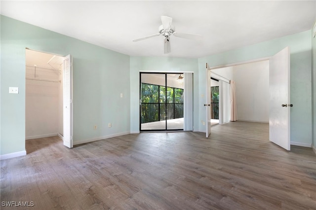 spare room featuring ceiling fan and light hardwood / wood-style flooring