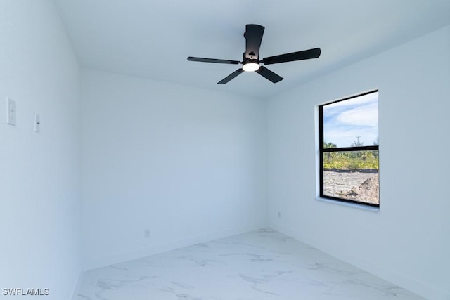 spare room with ceiling fan