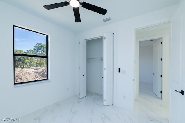 unfurnished bedroom featuring ceiling fan