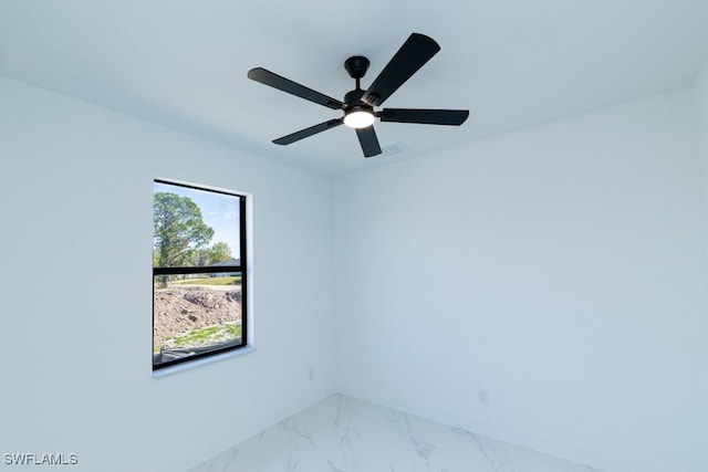 spare room with ceiling fan