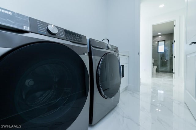 washroom with separate washer and dryer