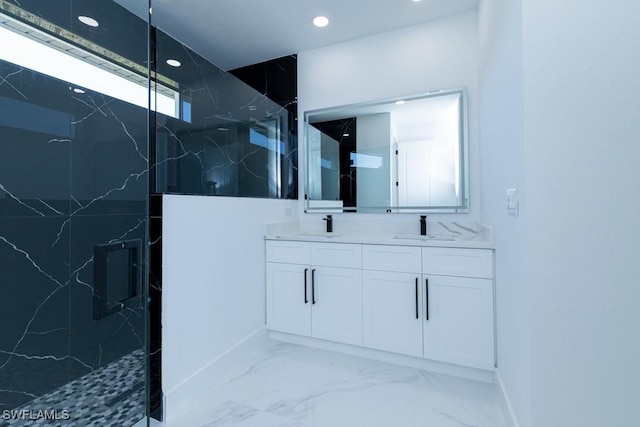 bathroom featuring vanity and a tile shower