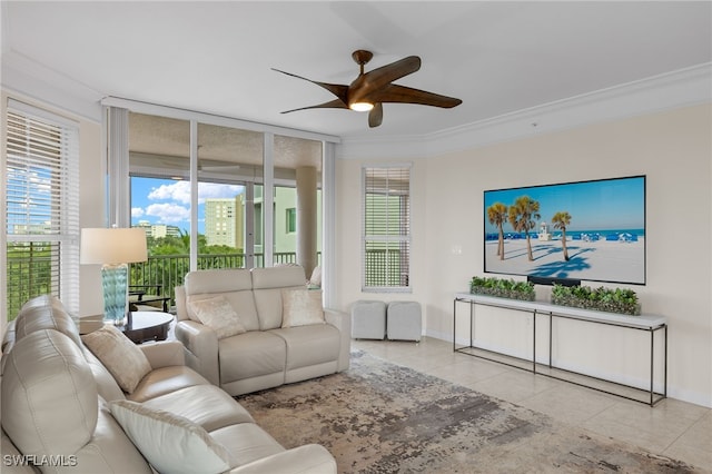 living room featuring crown molding, ceiling fan, and light tile patterned flooring