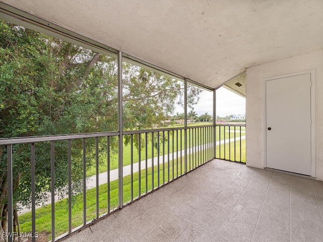 unfurnished sunroom featuring a wealth of natural light