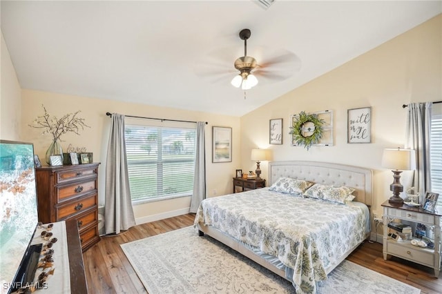 bedroom featuring ceiling fan, vaulted ceiling, and hardwood / wood-style floors