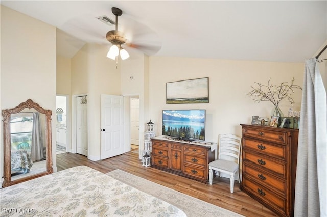 bedroom featuring ceiling fan, high vaulted ceiling, and light hardwood / wood-style floors