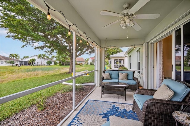 sunroom / solarium with ceiling fan