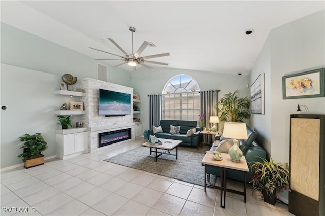 living room with ceiling fan, high vaulted ceiling, and light tile patterned floors