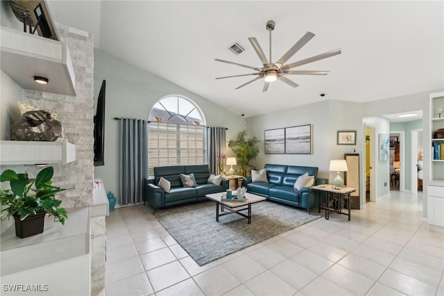 living room featuring light tile patterned flooring, vaulted ceiling, and ceiling fan