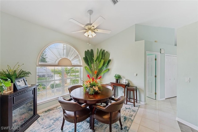 tiled dining area featuring ceiling fan